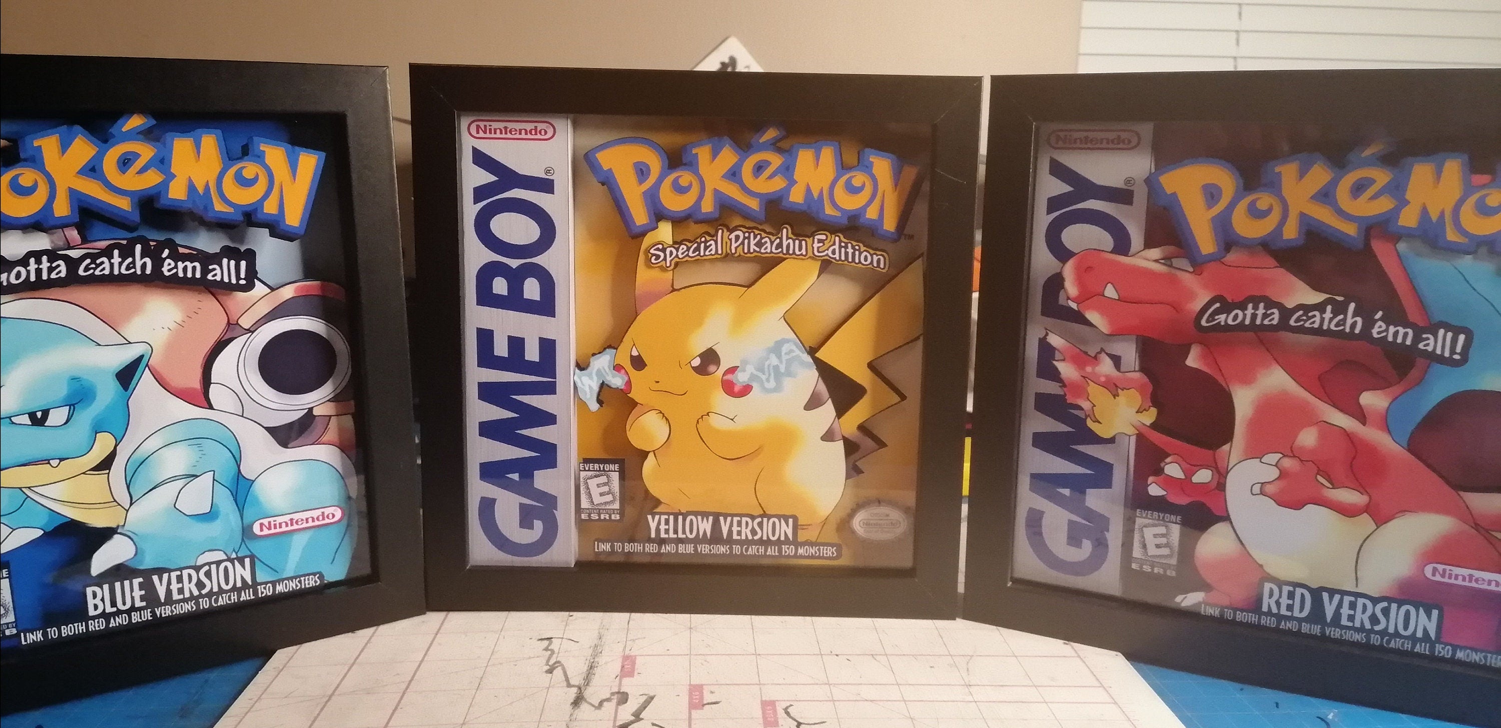 Pokemon Yellow, blue, and red shadowbox 3 pack